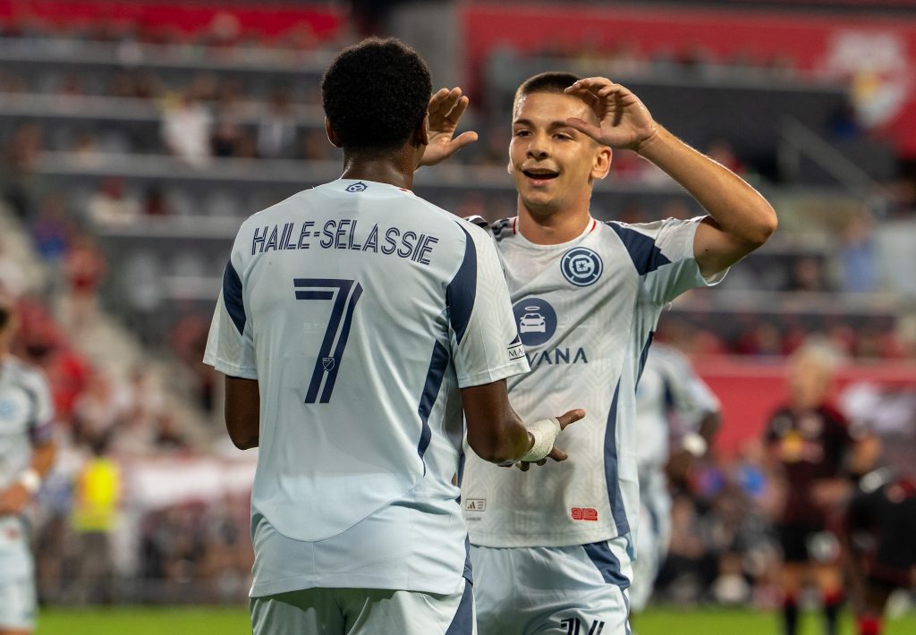 Player congratulated for his goal