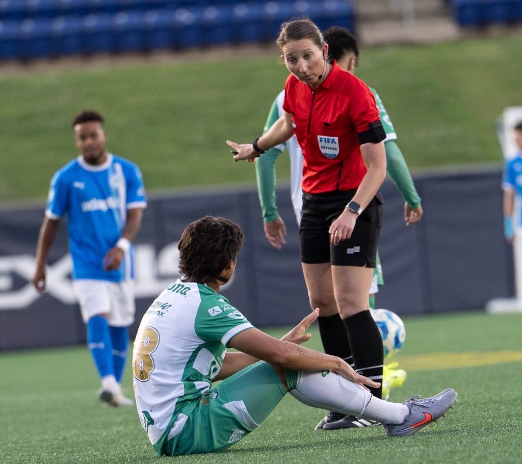 Referee gives a stern warning to a Santos Laguna player during the international friendly against Annapolis Blues.