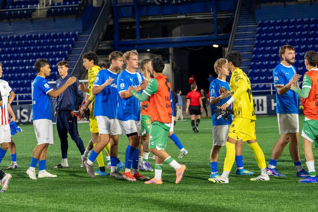Annapolis Blue and Club Santos lagunas players show appreciation to each other in a great international friendly