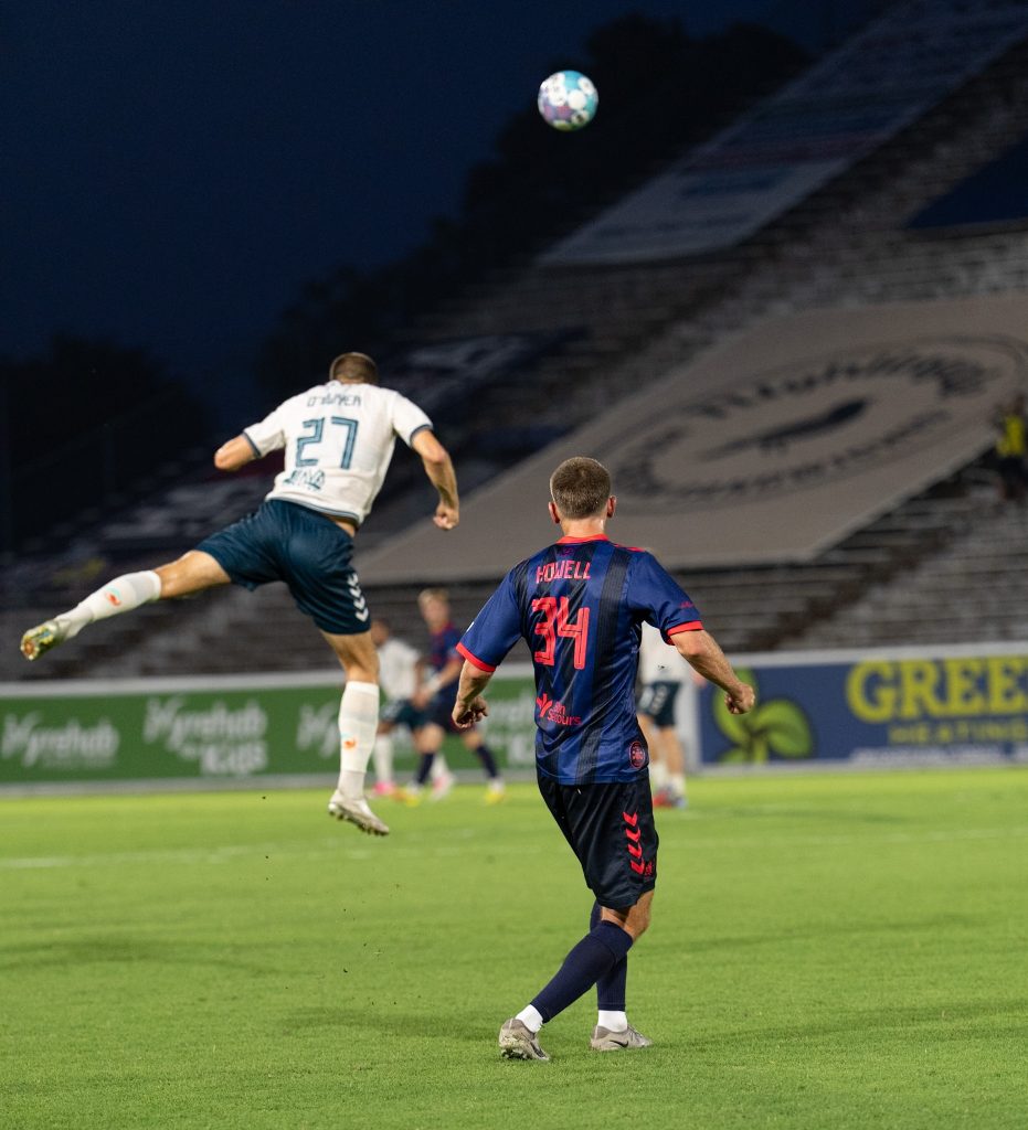 Sarasota Paradise defender rises for a header against Richmond Kickers at City Stadium.