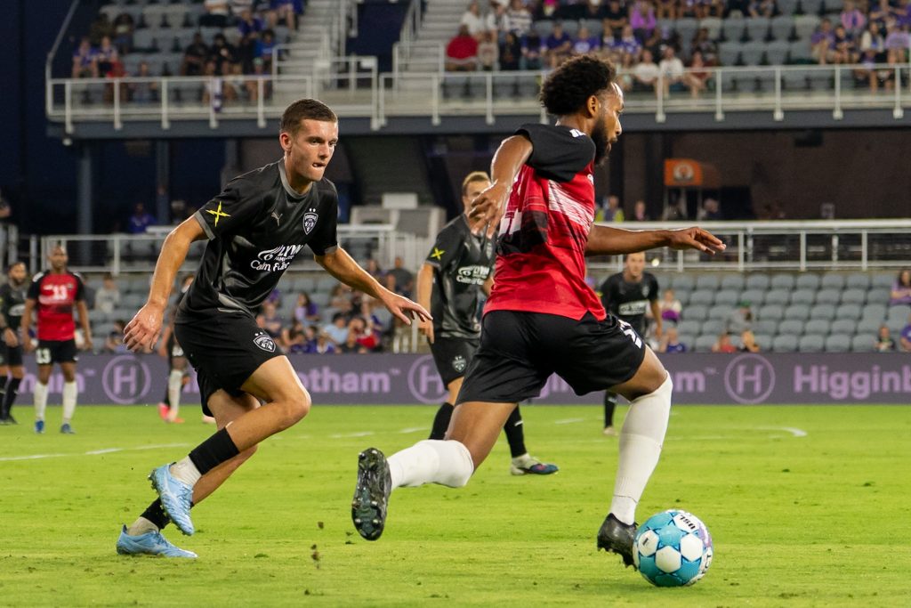 Trinidad and Tobago midfielder taking on Louisville City down the wing