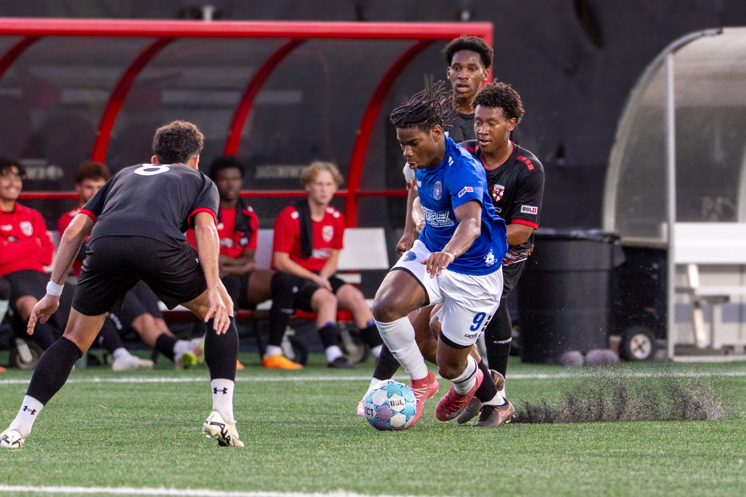 Virginia Marauders and Loudon United FC players battle for possession during USL Two action