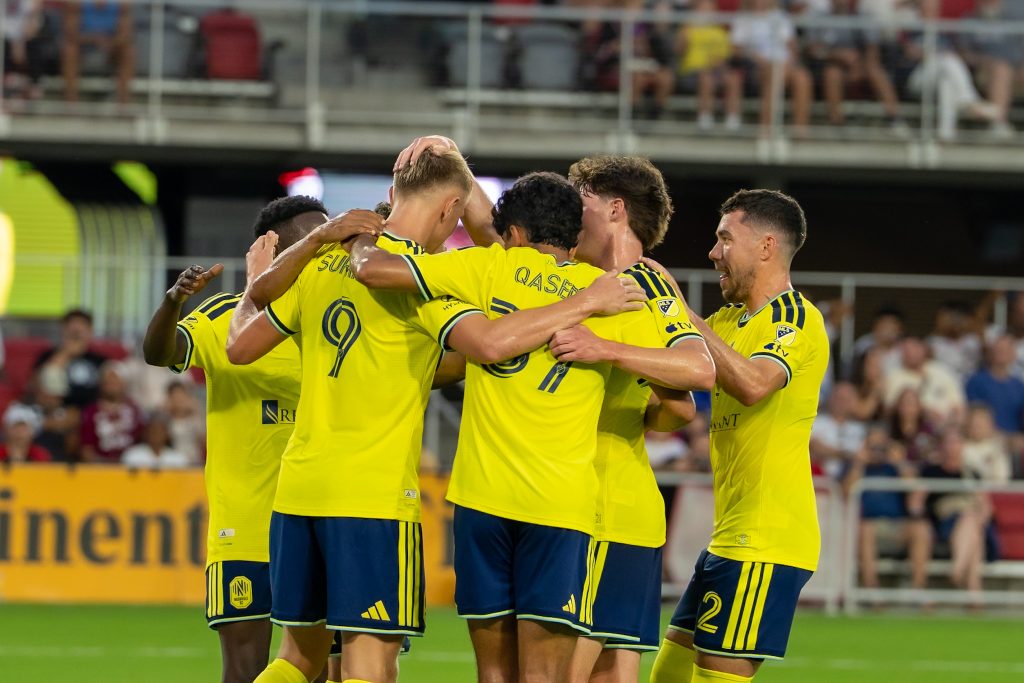 Nashville SC celebrates their opening goal against DC United