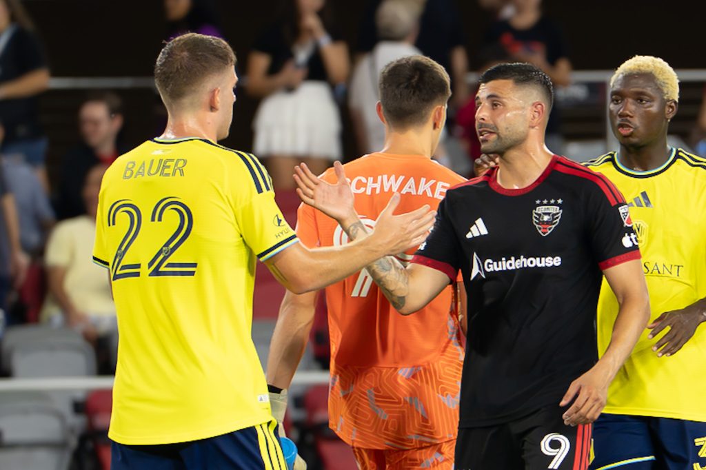 Players showing appreciation for each other at the end of the game
