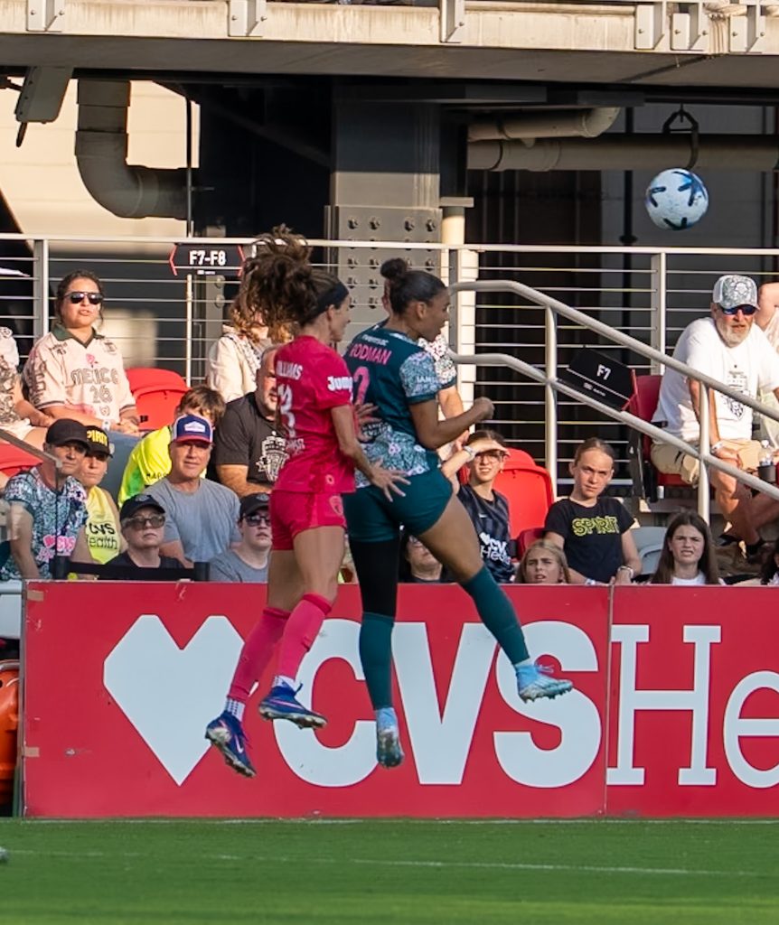 Players from Washington Spirit challenge an air ball