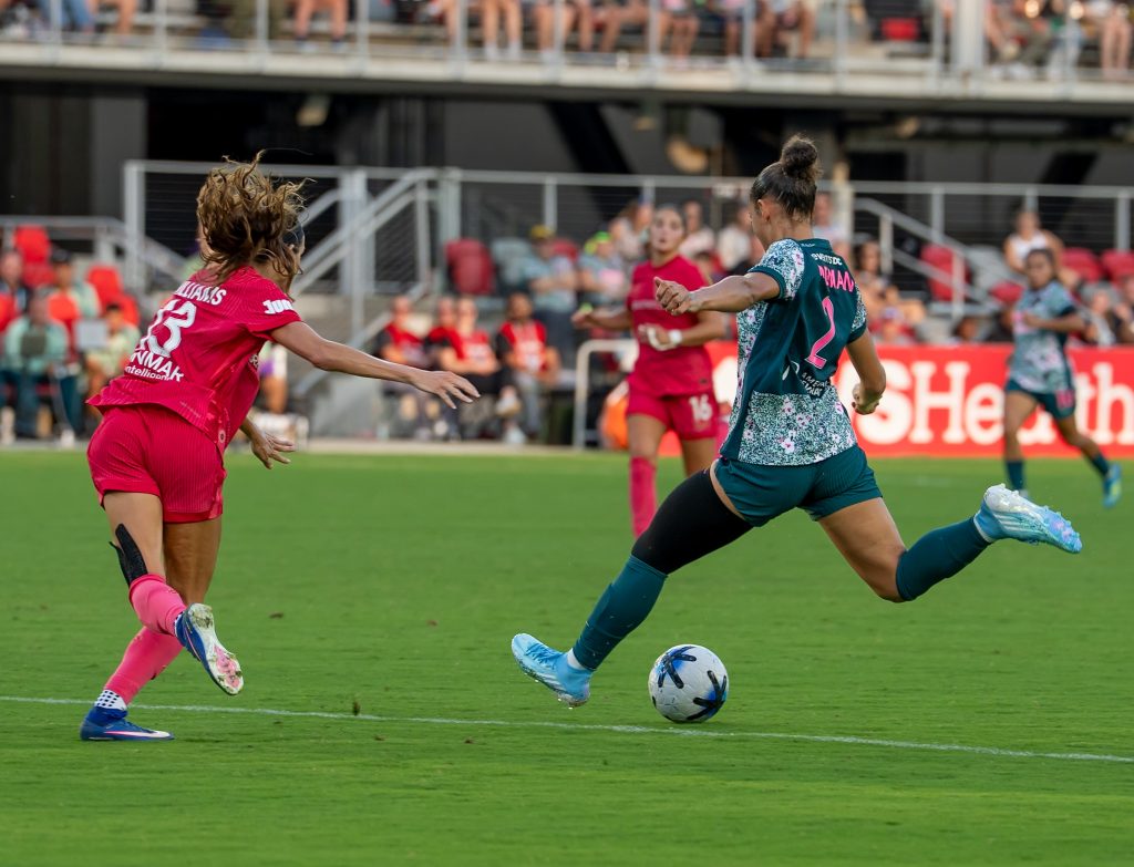 Rodman of Washington Spirit tries a cross against NC Courage defender