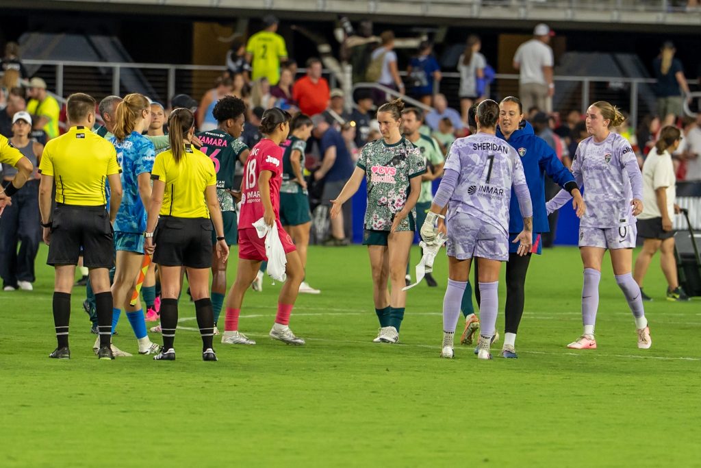 Players of both Washington Spirit and NC Courage appreciate each other at the sound of the final whistle