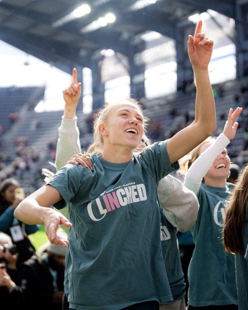 Spirit’s Morgan celebrating with fans and teammates